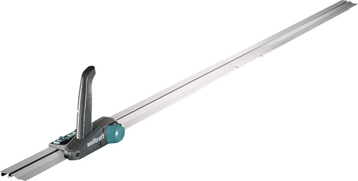 Une longue règle en argent avec une poignée noire et des accents verts, probablement un guide de coupe pour des découpes précises.