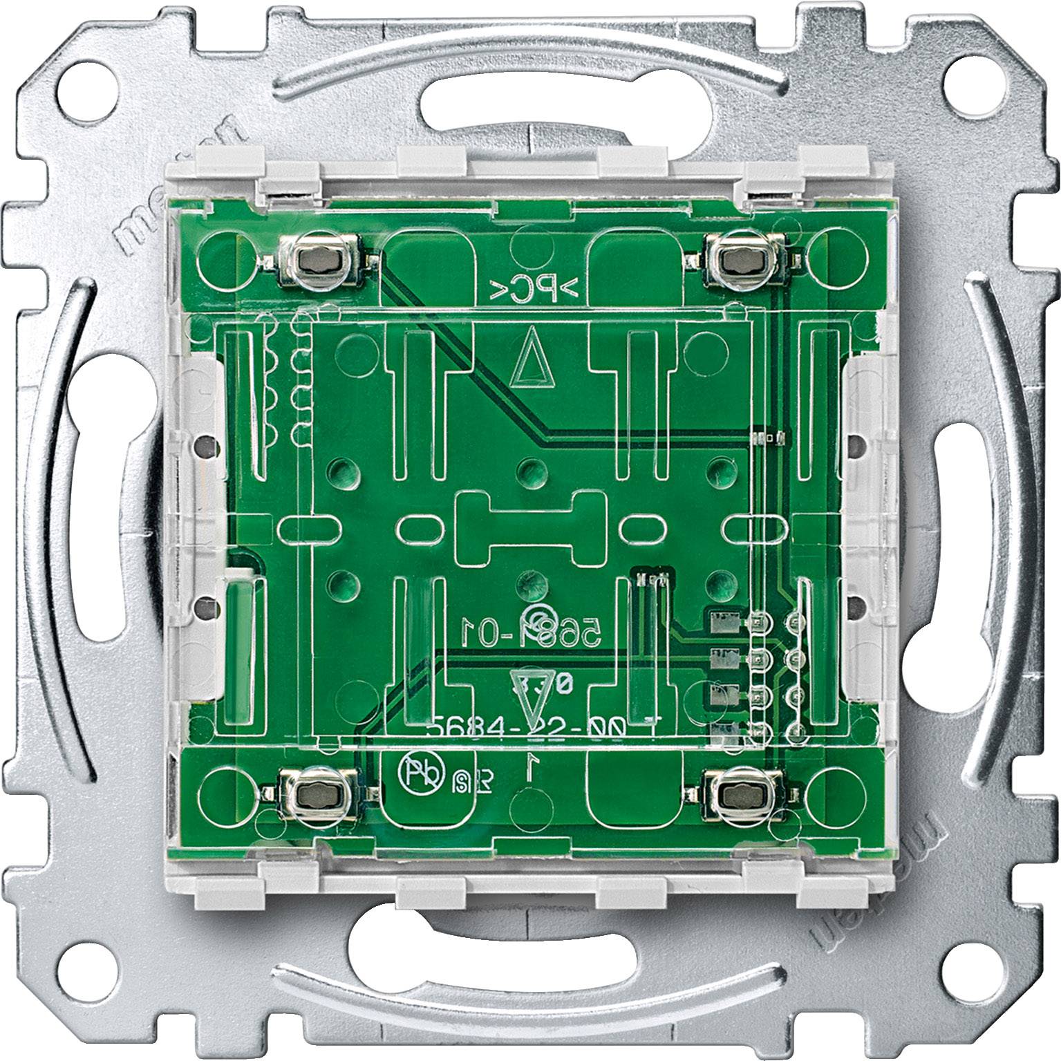 Un cadre de boîtier métallique vide, préparé pour le montage d'un interrupteur électrique ou d'une prise, avec un noyau de circuit imprimé vert.