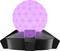 Objet géométrique lumineux teinté en rose sur une base noire. Décoratif, probablement utilisé comme lampe ou élément de design.