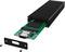 Un appareil électronique vert avec un dissipateur thermique noir et un couvercle métallique ouvert révèle une carte de circuit imprimé équipée d'un port USB-C.