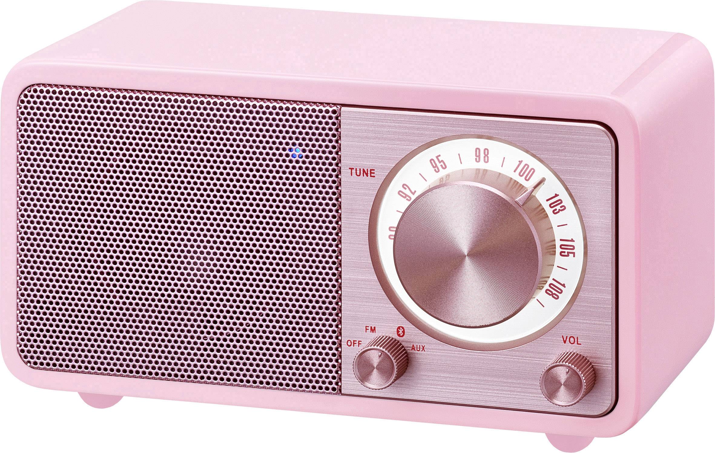 Un poste de radio rétro rose avec de grands boutons de volume et un sélecteur de fréquence rotatif ; design dans un style vintage.