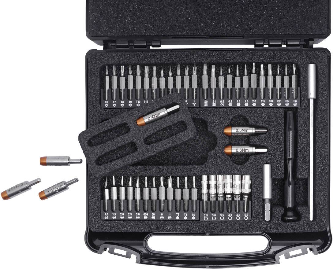 Mallette à outils comprenant différents embouts, clés dynamométriques et tournevis, soigneusement organisés dans un insert en mousse.