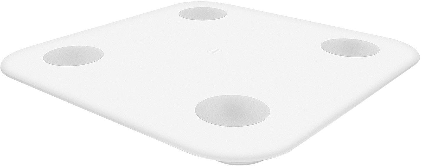 Une table carrée aux coins arrondis avec quatre cavités rondes, adaptée à diverses applications ou décorations.