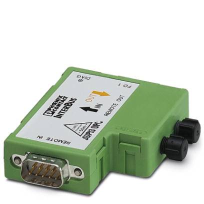 Un module électronique vert est représenté, doté d'un connecteur D-Sub. Des inscriptions et deux flèches de guidage sont visibles en haut de l'image.