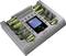 Chargeur avec huit emplacements pour piles AA et AAA, quatre emplacements étant remplis de piles. Marque 'Voltcraft'.