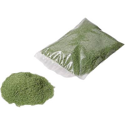 Un sachet de poudre verte, partiellement renversé à côté.