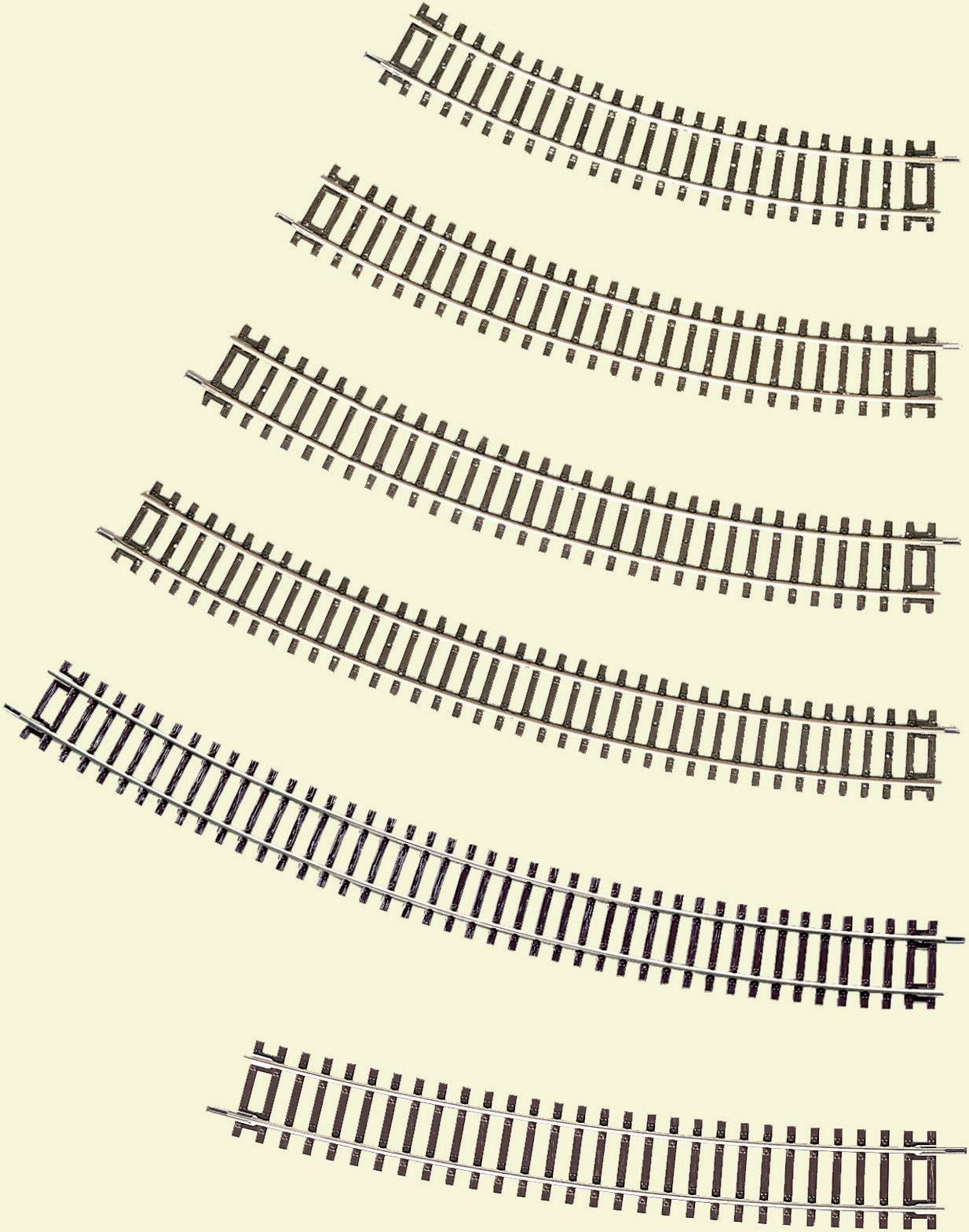 Plusieurs rails de modélisme ferroviaire courbés de différents rayons de courbure sur un fond clair.