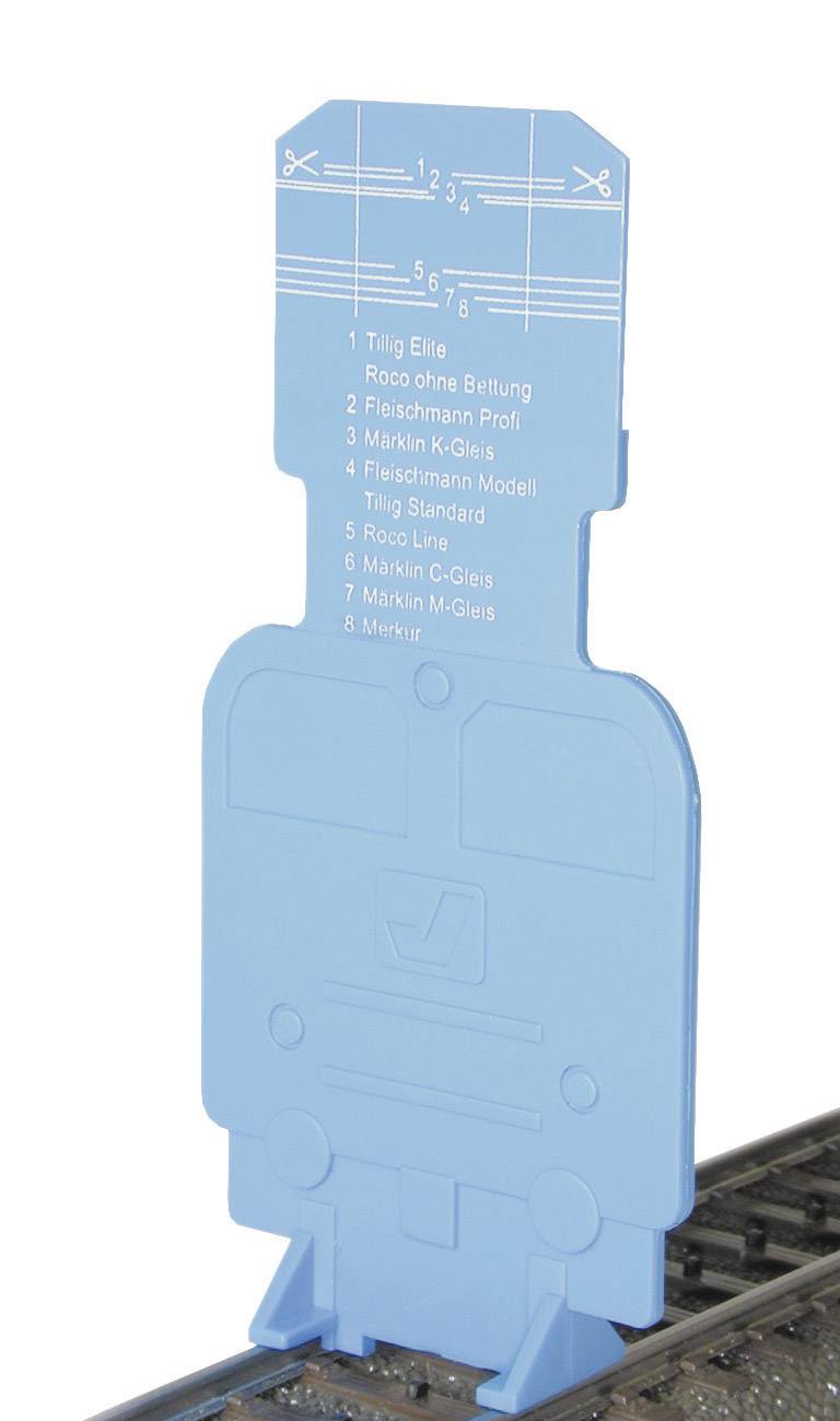 Outil en plastique bleu sur des voies de chemin de fer miniature, permettant de mesurer différents profils de voies à l'aide de plusieurs gabarits.