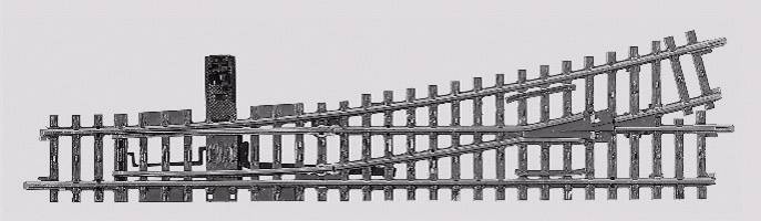 Aiguillage métallique en vue frontale avec un commutateur pour changer la position de l'aiguille sur une surface grise.