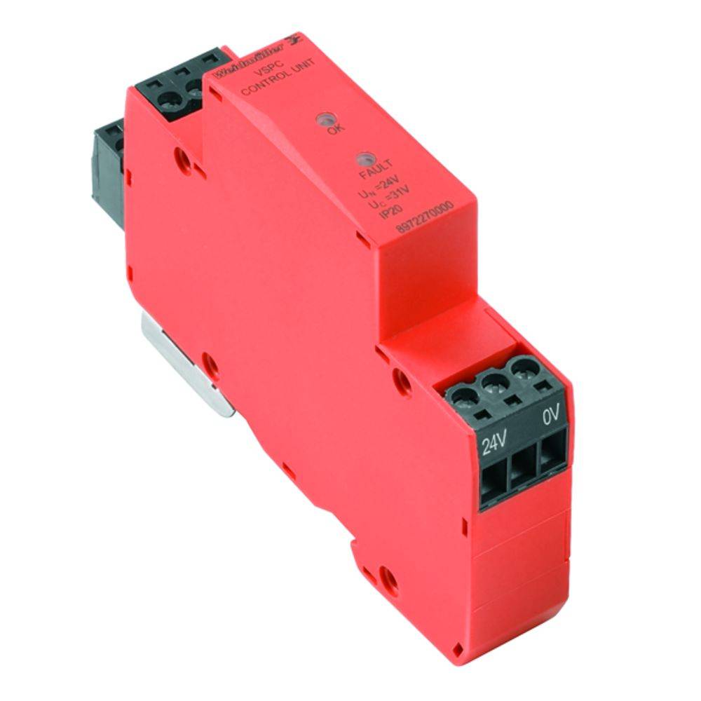 Appareil électronique dans un boîtier rouge, probablement un module d'électronique de commutation, avec des connexions pour l'entrée de tension 24V et 0V.