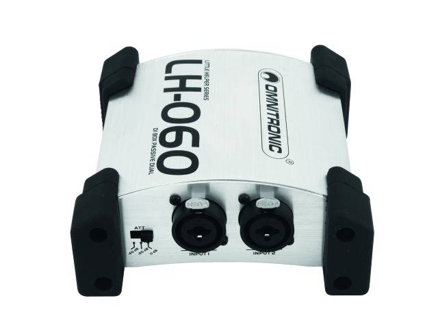 Un adaptateur de signal de volume Omnitronic LH-060 argenté avec deux entrées XLR, un interrupteur et des embouts en caoutchouc noir.