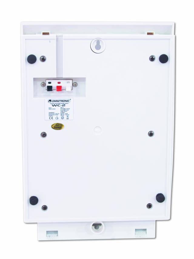 Dispositif électronique blanc avec une étiquette au centre, fixé au mur. Deux interrupteurs sont situés en haut.