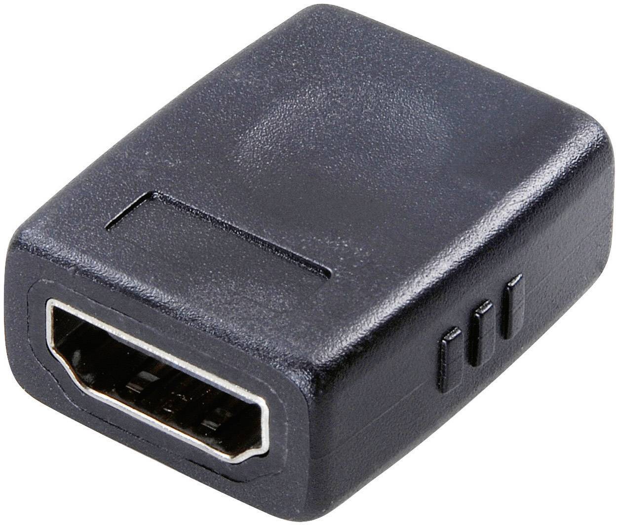 Un adaptateur HDMI noir avec un connecteur femelle HDMI sur l'avant, adapté pour connecter des câbles HDMI.