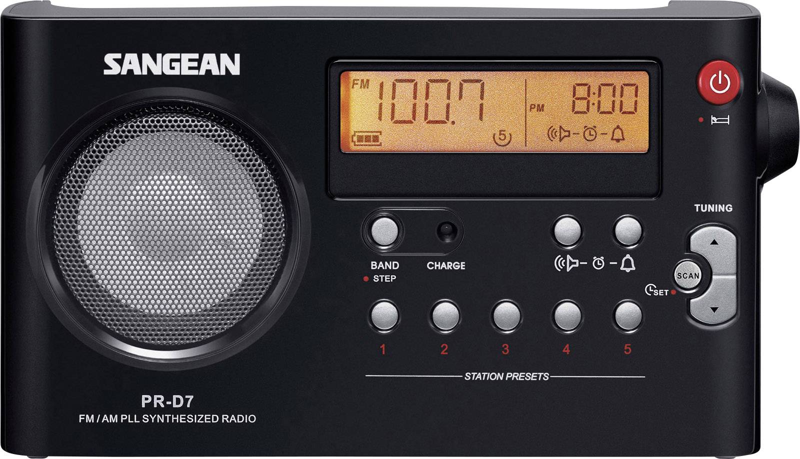 Un poste de radio noir avec un affichage numérique indique la fréquence 100,7 FM. À gauche se trouve un haut-parleur, à droite les touches de commande.