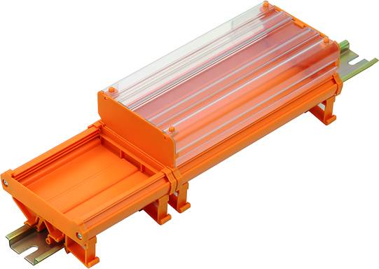 Connecteur plastique orange avec couvercle transparent, adapté pour relier des câbles ou des conduites de manière sécurisée.
