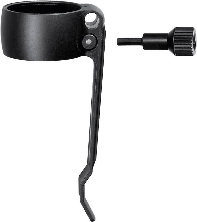 Support de vélo noir et outil à vis, disposés sur le côté. Utilisé pour fixer ou ajuster des composants de vélo.