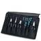 Un sac à outils noir contenant divers outils manuels tels que des pinces, des tournevis et un fer à souder, soigneusement rangés.
