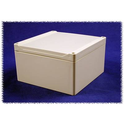Un boîtier rectangulaire en plastique couleur crème sur un fond bleu foncé.