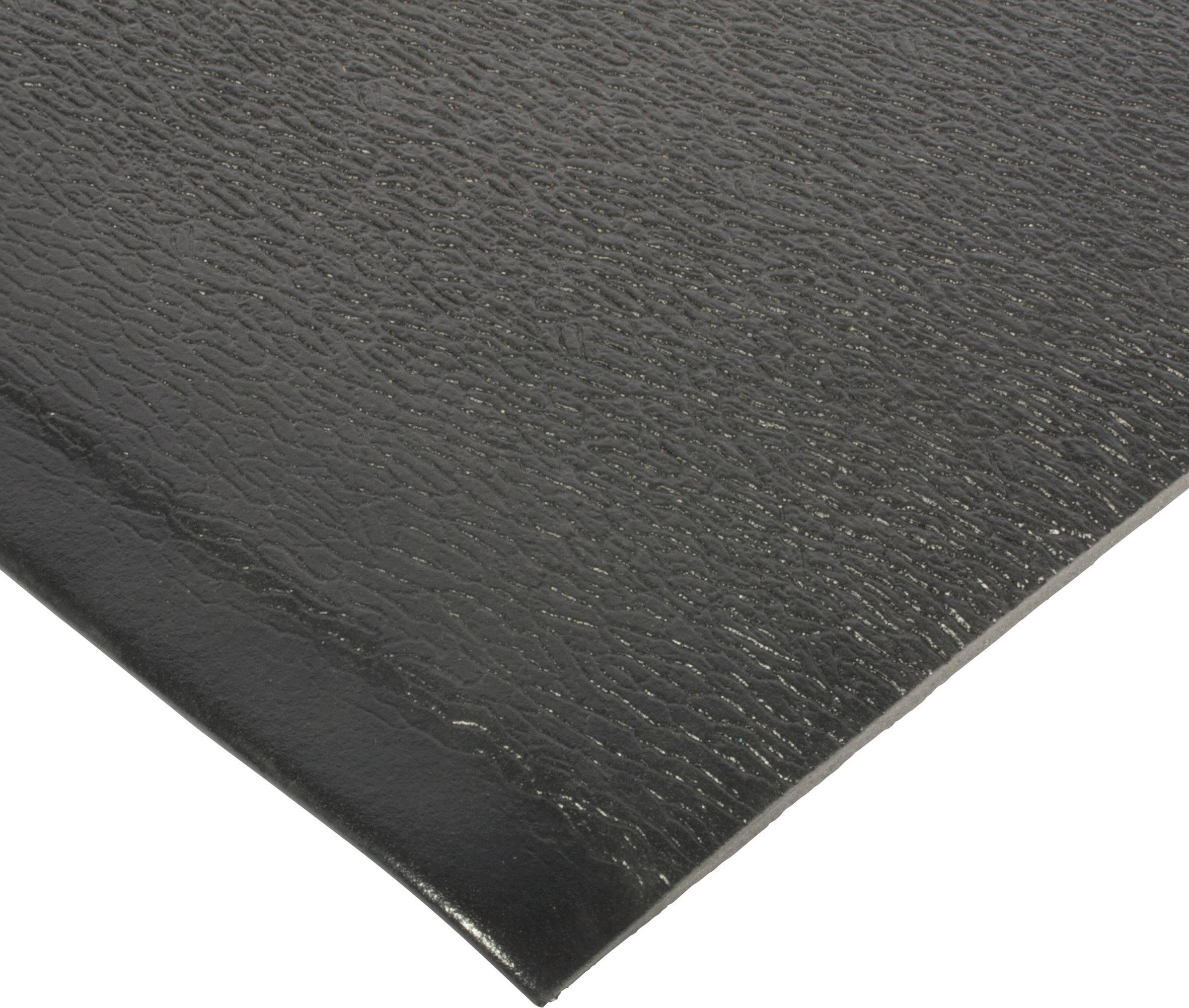 Surface noire structurée d'un revêtement en caoutchouc, représentée en diagonale.