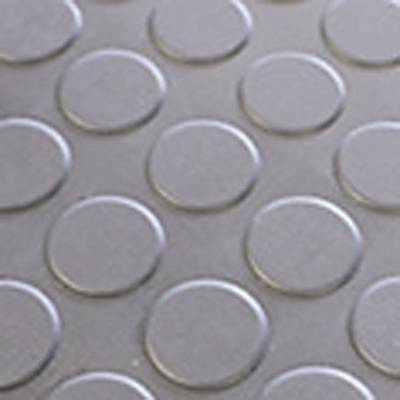 Points ronds et surélevés sur une surface lisse, disposés selon un motif régulier.