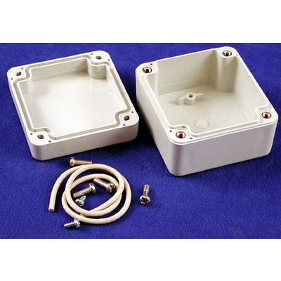 Deux boîtiers carrés en plastique ouverts sur un fond bleu, à côté des vis et une courte corde pour le montage.