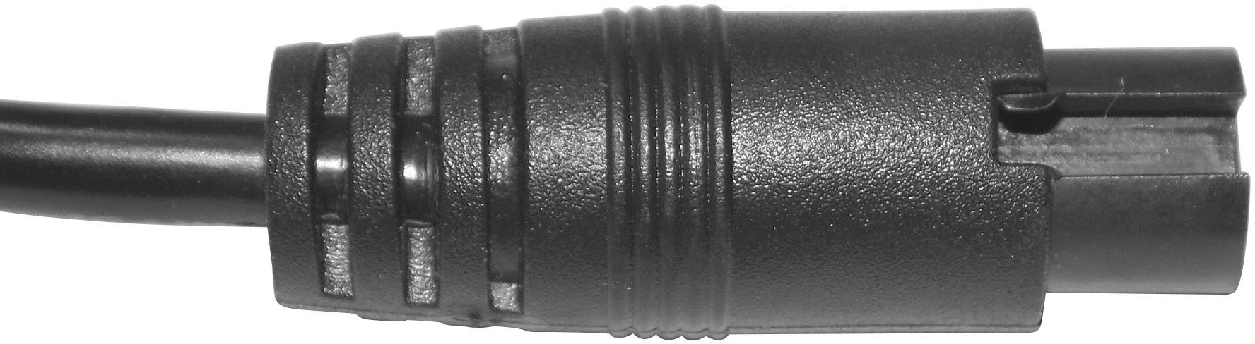 Fiche cylindrique noire qui s'adapte aux appareils électroniques, présentant une structure circulaire et plusieurs rainures.