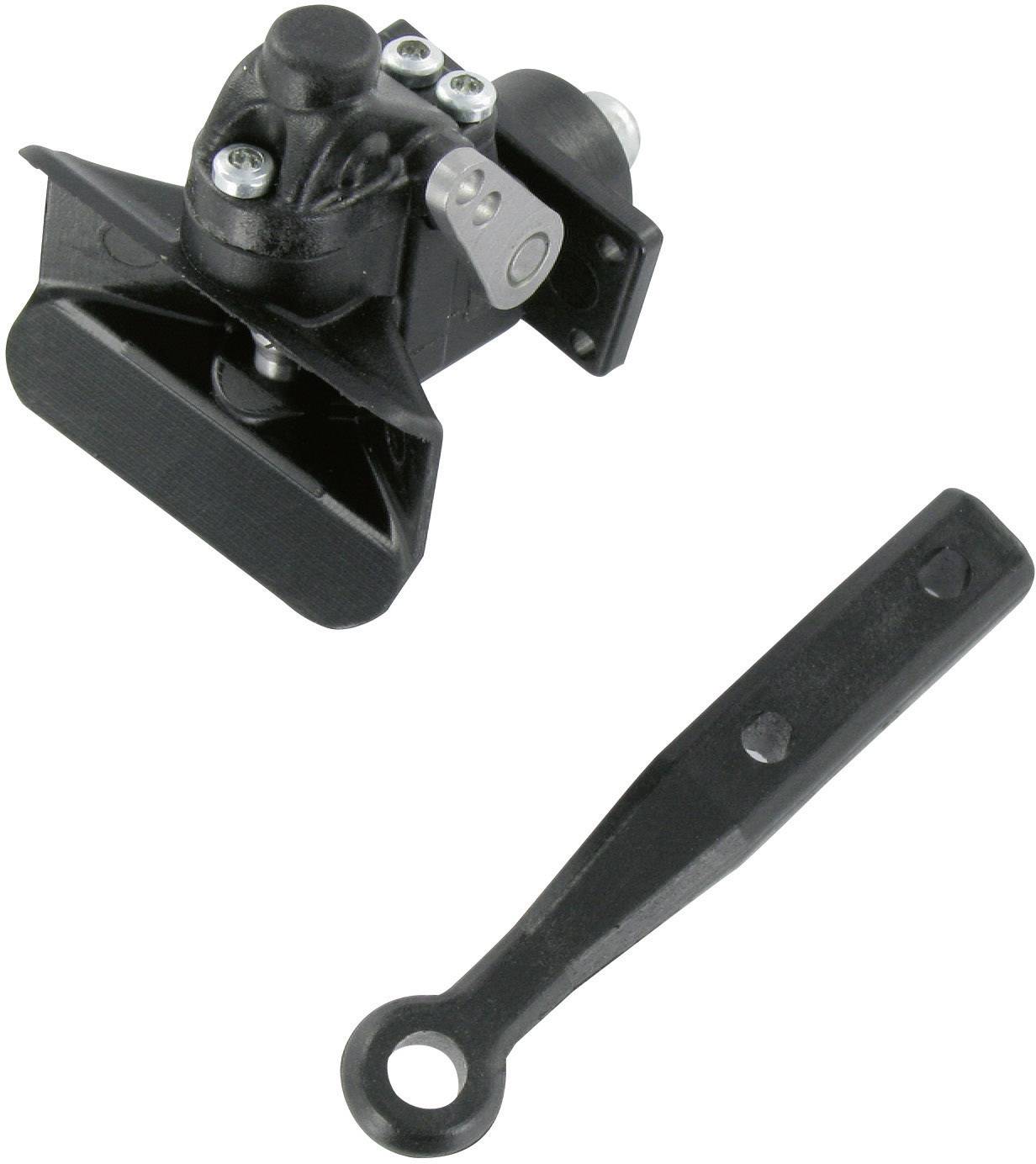 Dispositif mécanique noir avec un levier, probablement un type de mécanisme de maintien ou de verrouillage.