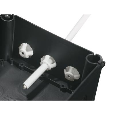 Gros plan sur un boîtier noir avec trois fixations en plastique blanc et un câble dépassant d'un support.