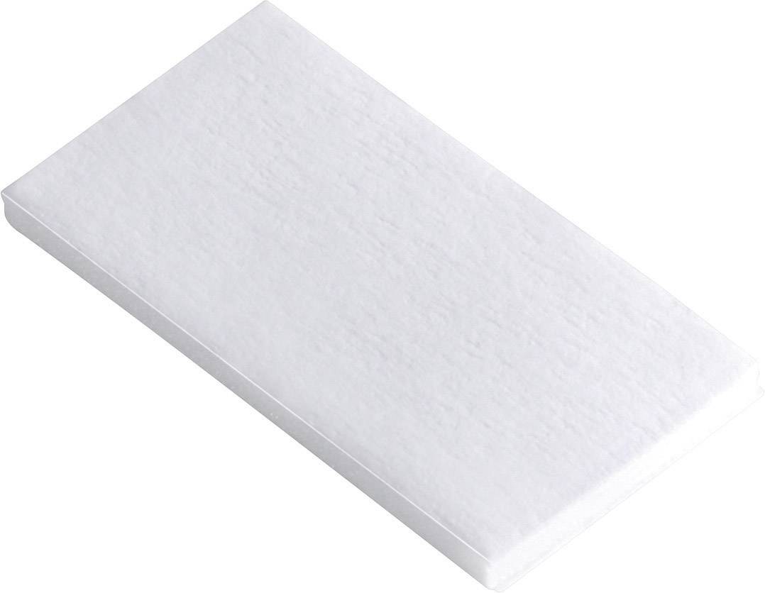 Un gomme blanche rectangulaire sur un fond neutre.