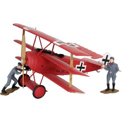 Un avion modèle biplan rouge de style Première Guerre mondiale, flanqué de deux figurines en uniformes militaires représentant des travaux de maintenance.
