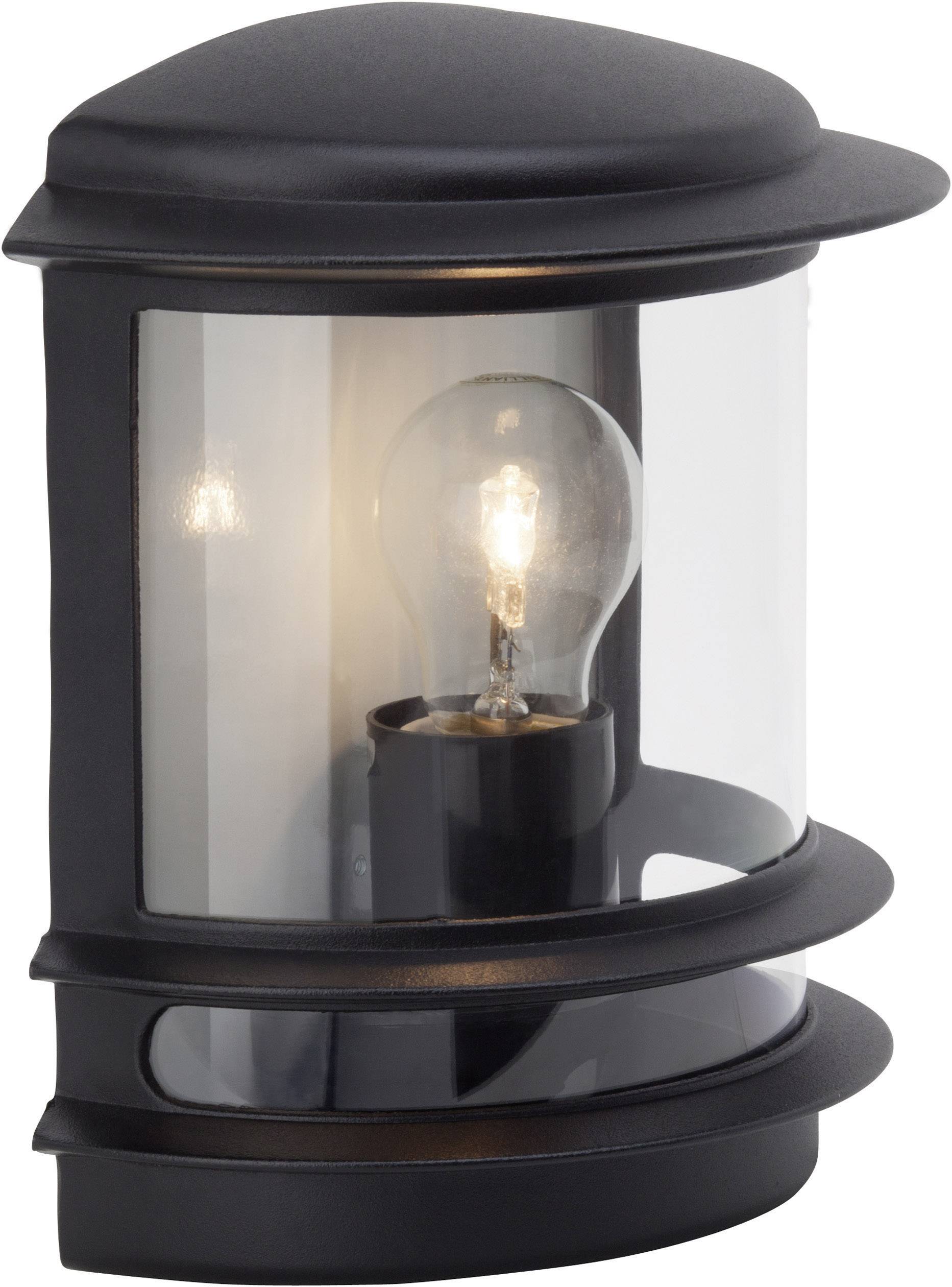 Applique murale extérieure noire avec ampoule visible derrière du verre, diffusant une lumière chaude.