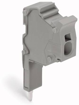 Bloc de connexion électrique en plastique gris avec une ouverture pour câbles. Utilisé dans les armoires électriques.
