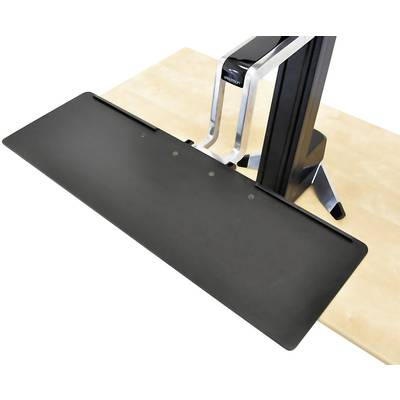 Un accessoire de plateforme noir et rectangulaire, monté sur un support argenté posé sur une table claire ; probablement un équipement de bureau ou de studio.