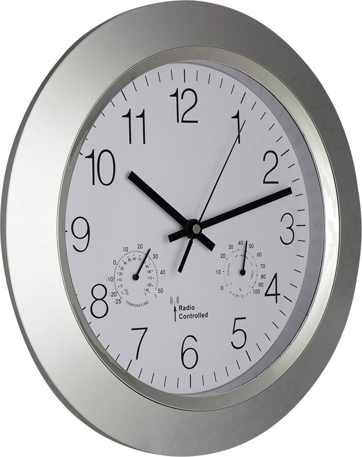 Une horloge murale analogique avec un cadre argenté affiche 10:09. Sous le cadran, deux petits affichages indiquent la température et l'humidité.