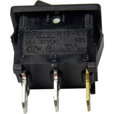 Un interrupteur noir avec trois contacts métalliques. Étiquetage : 'SCI R13-66', '16A', '12VDC', 'T85', avec des symboles d'homologation.