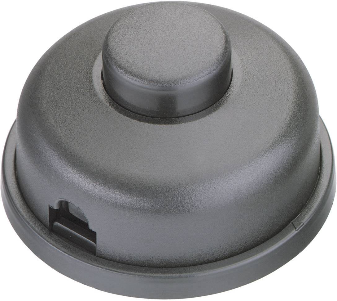 Boîtier en plastique noir de forme circulaire, avec un centre légèrement bombé, probablement un couvercle ou un capot pour un appareil.