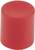 Un cylindre unique en mousse rouge est dressé verticalement devant un fond blanc.
