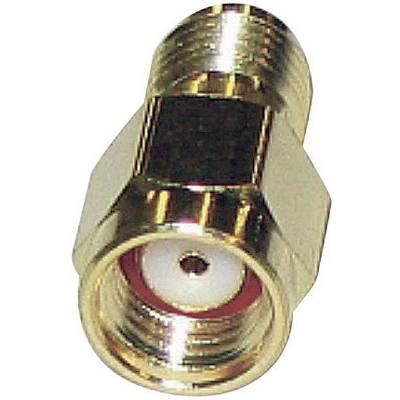 Un adaptateur de câble coaxial en métal vu de dessus, avec un point de contact central visible.