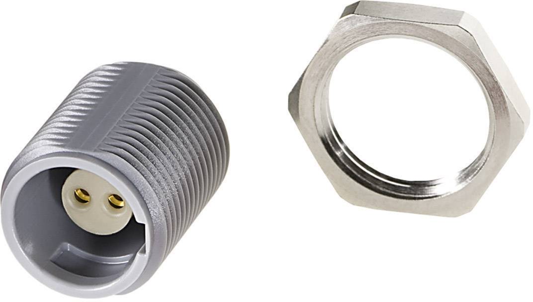 Une pièce cylindrique grise striée à côté d'un anneau de connexion hexagonal argenté sur un fond blanc.
