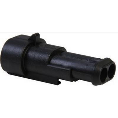 Un connecteur électrique noir avec deux ouvertures de raccordement rondes, adapté pour une utilisation dans divers appareils électroniques.