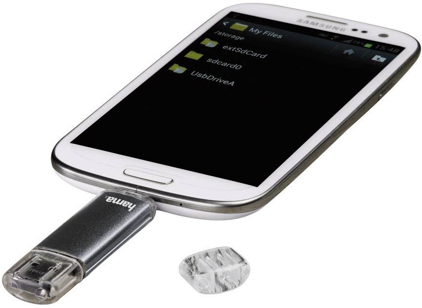 Un smartphone est connecté à une clé USB via un adaptateur. L'écran affiche le gestionnaire de fichiers avec différentes options de stockage.