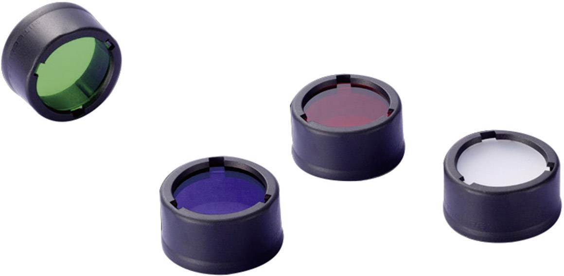 Quatre filtres de lentille colorés avec supports : vert, rouge, bleu et transparent. Ils sont disposés côte à côte, le vert semblant flotter.