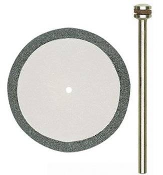 Disque abrasif et tige métallique : Un disque abrasif gris avec un trou au centre, placé à côté d'une longue tige métallique, prêt pour le montage d'un outil.