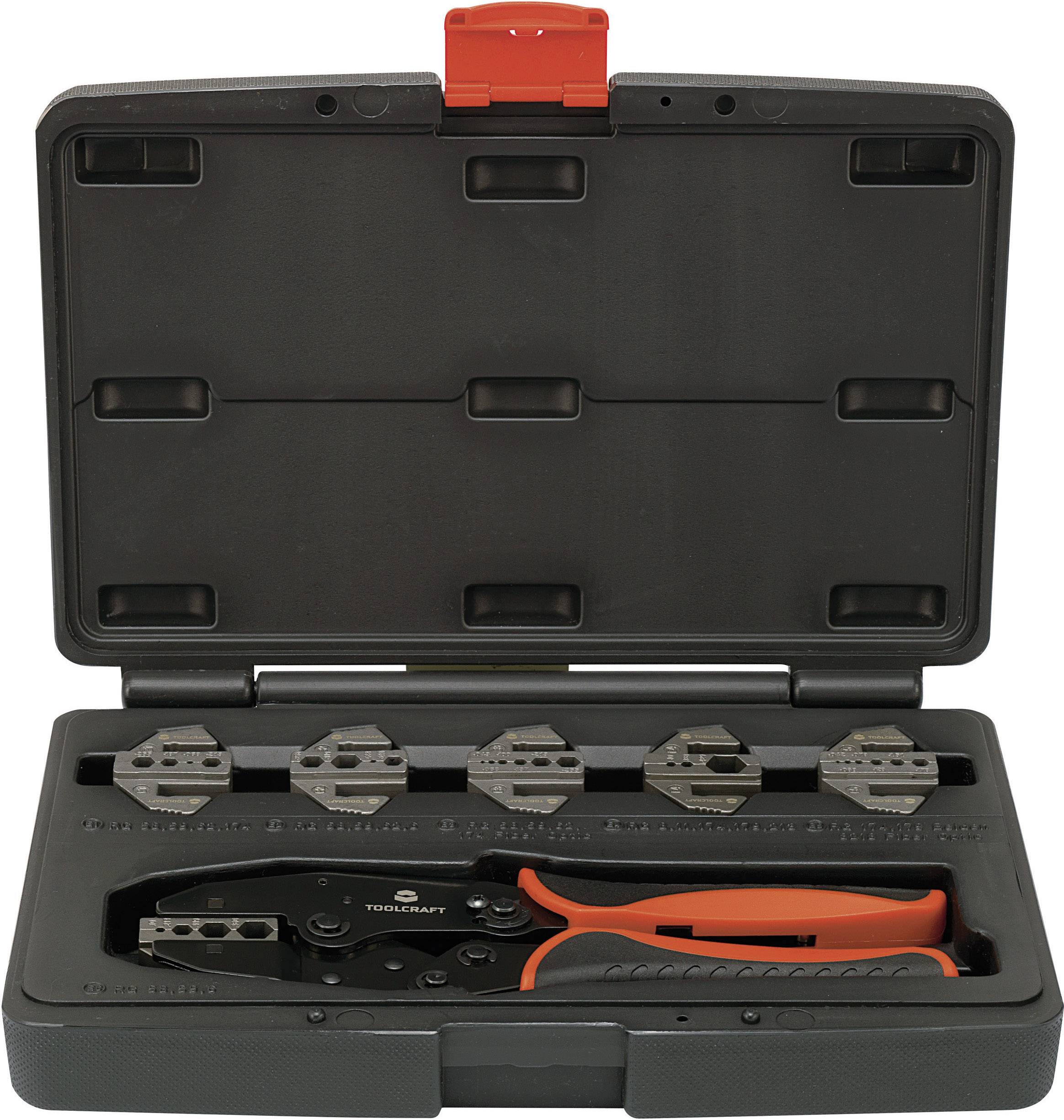 Un ensemble de pinces à sertir dans un boîtier noir ouvert, comprenant cinq embouts interchangeables et une pince avec une poignée orange.