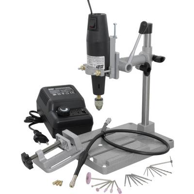 Un outil rotatif multifonctionnel avec support, chargeur, perceuse et accessoires tels que des embouts de ponçage et de polissage.