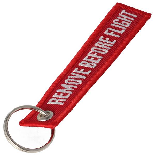 Pendentif avec l'inscription Remove before flight Mini, dimensions env.10,9 x 2,2 cm