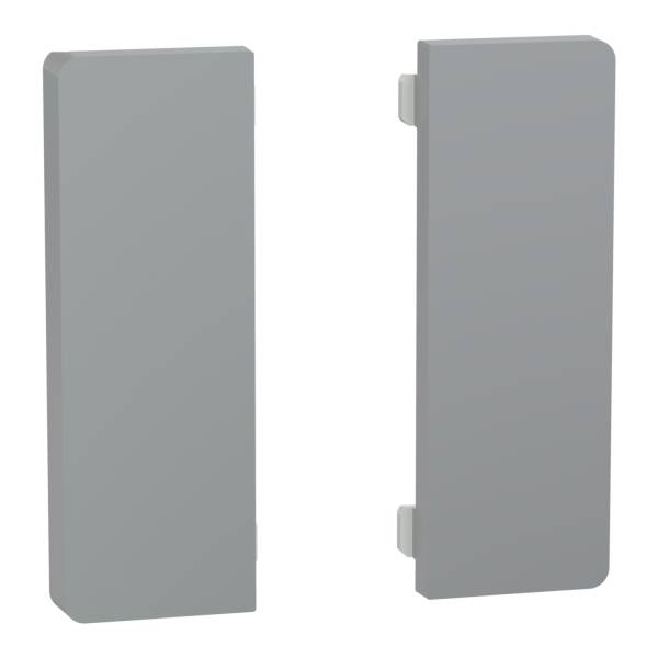 Deux caches rectangulaires gris sont disposés verticalement, probablement en plastique ou en métal.