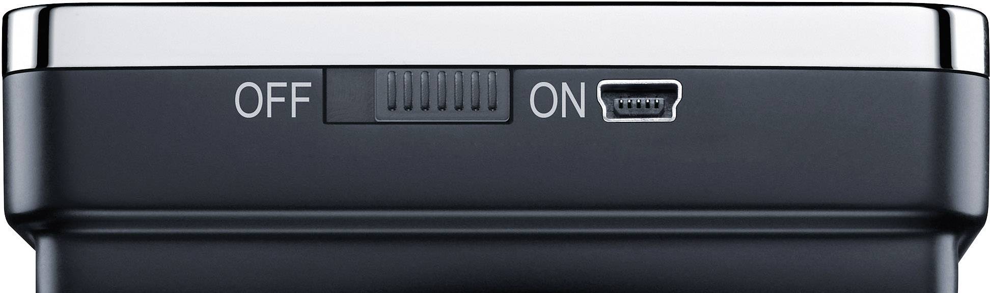 Appareil électronique noir avec un interrupteur coulissant et un port mini-USB, l'interrupteur étant en position 'MARCHE'.