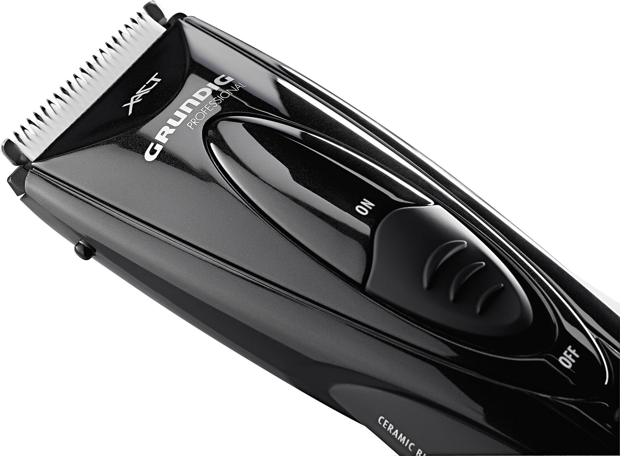 Tondeuse à cheveux brillante noire Grundig avec interrupteur marche/arrêt et lames tranchantes pour une coupe précise.