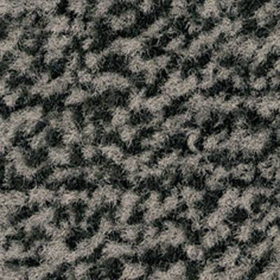 Gros plan sur une texture gris-noir semblable à un tapis ou un motif de tissu avec un motif irrégulier et duveteux.